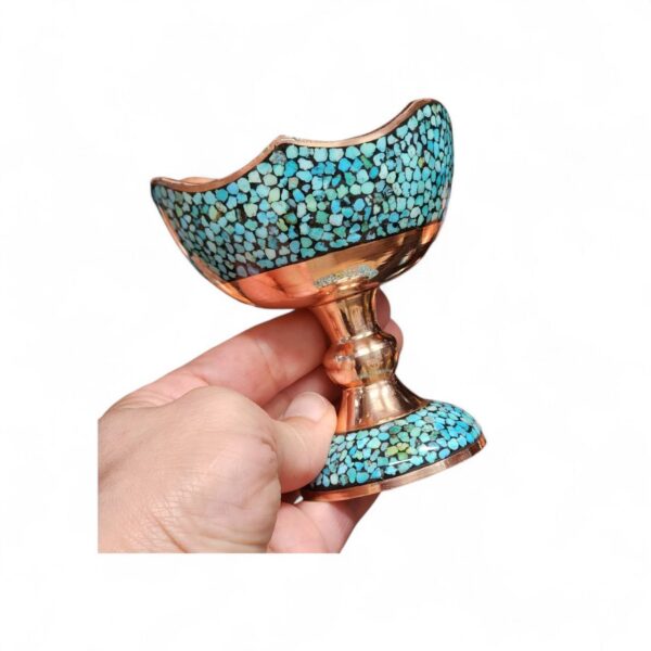 Close-up of natural turquoise inlay and engraved copper craftsmanship